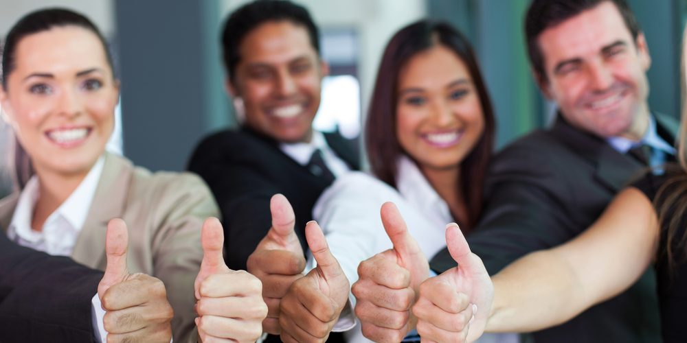 business group giving thumbs up